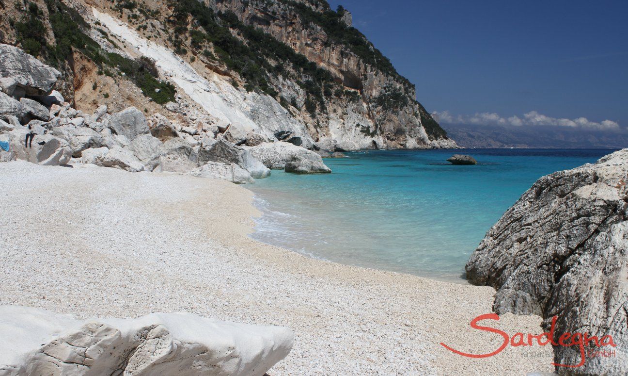 White, limestone beach of Cala Goloritze with view on the sea and the steep cliffs of the coast