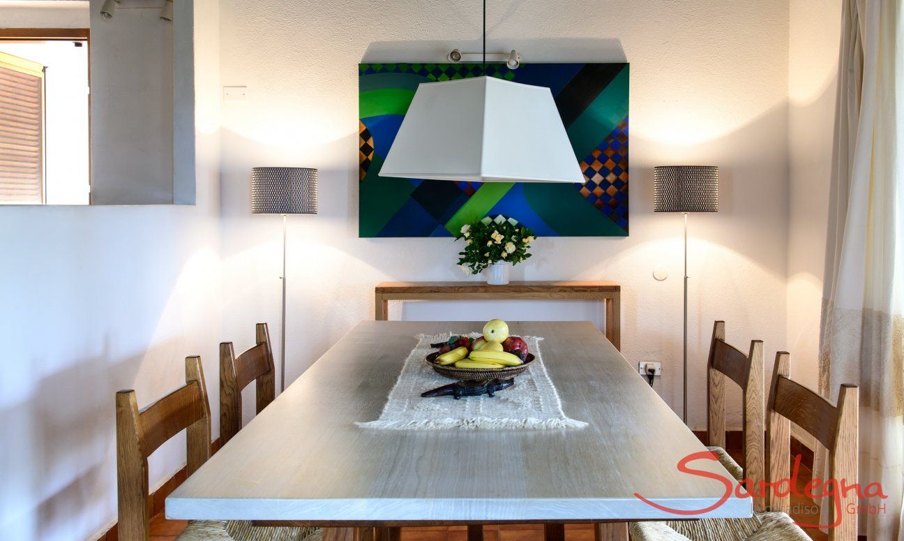 Dining table with light wooden surface