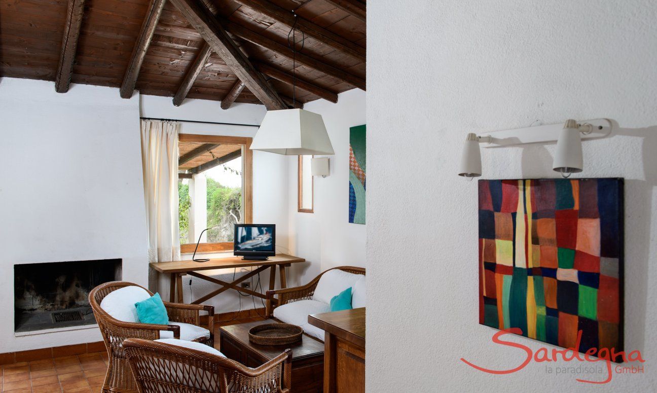 Villa Kika | Living area with TV and fireplace Living area with TV and fireplace