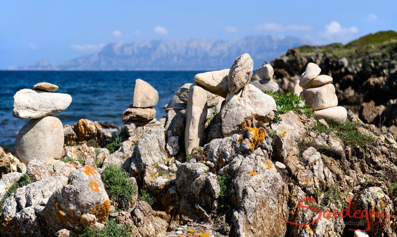 Rocks and the isle of Tavolara in the background