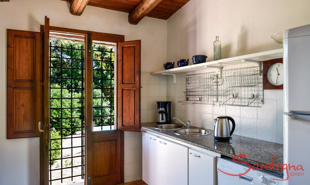 Kitchen with door to the pool