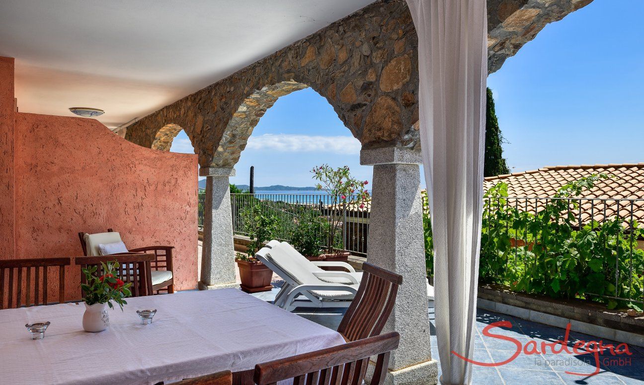 Apartment Castededdu 4 | Dining outside with a view over the sea of Costa Rei Dining outside with a view over the sea of Costa Rei