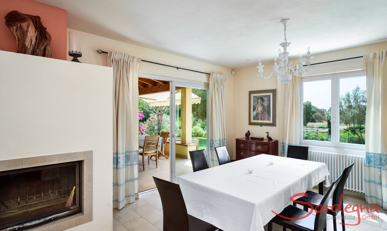 Dining area with chimney and terrace access