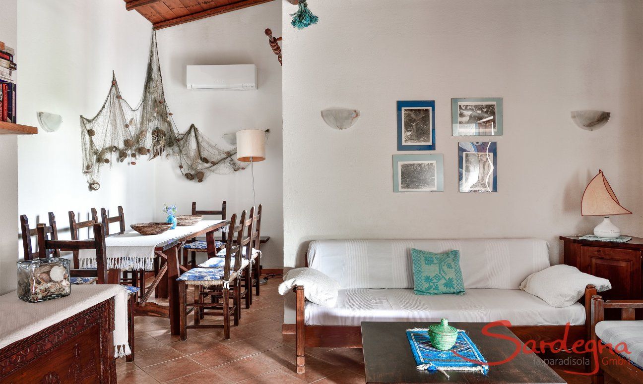 Villa Vela | Living area with sofa corner and dining table Living area with sofa corner and dining table