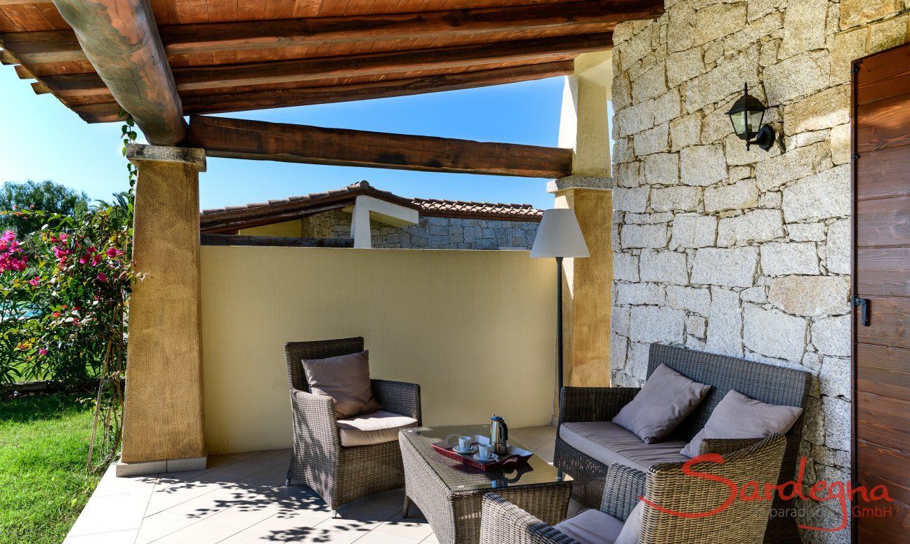 Outside couch on the roofed terrace of  Villa Campidano 21