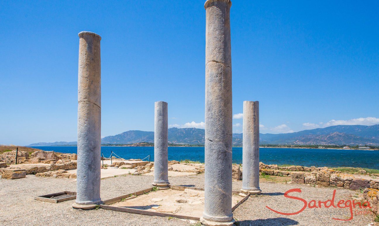 Roman columns and mosaics in the archeological site of Nora