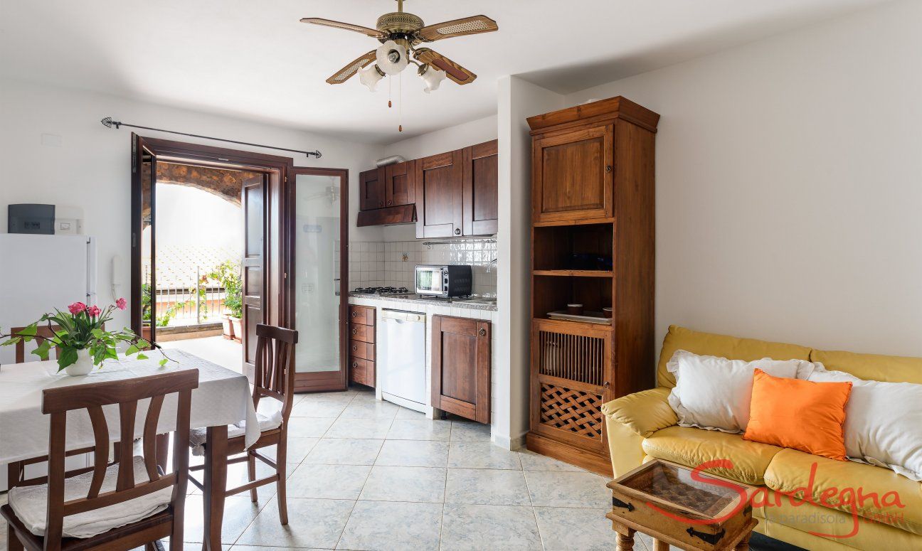 Apartment Castededdu 3 | Living area with kitchen, dining table and kitchen Living area with kitchen, dining table and kitchen