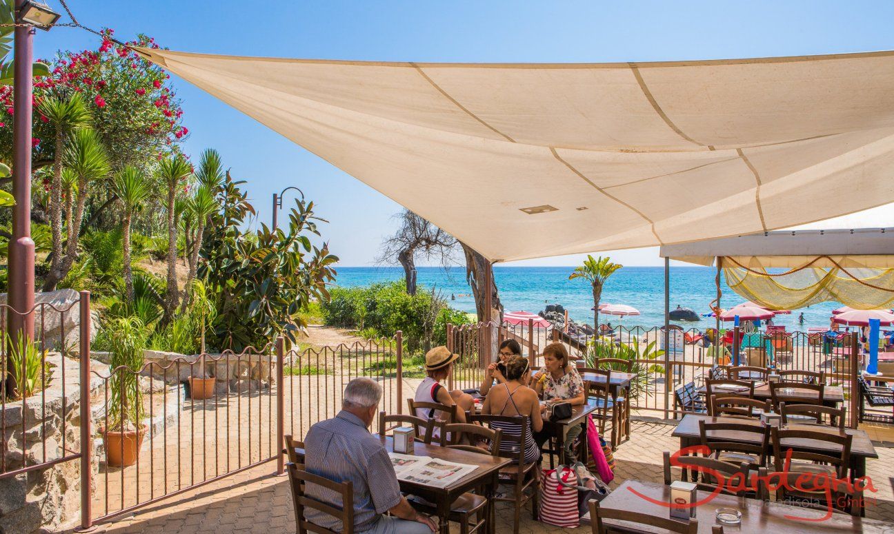 Restaurant on the beach with sail for shade