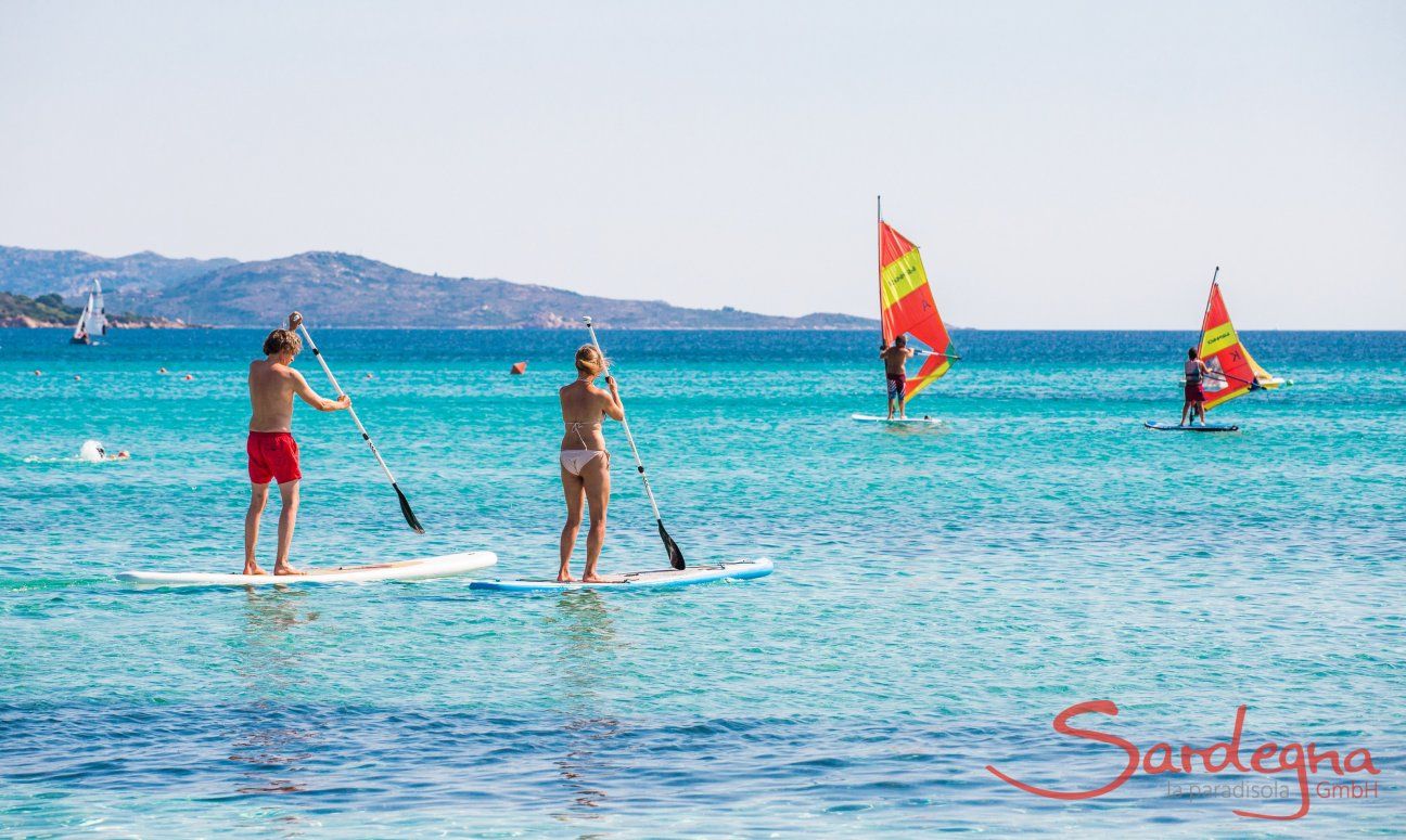 Stand-up paddle and Windsurf in the bay of La Cinta, San Teodoro, Olbia