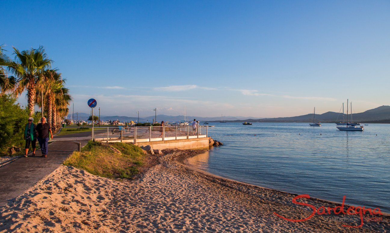 Sandy beach right in the town of Golfo Aranci