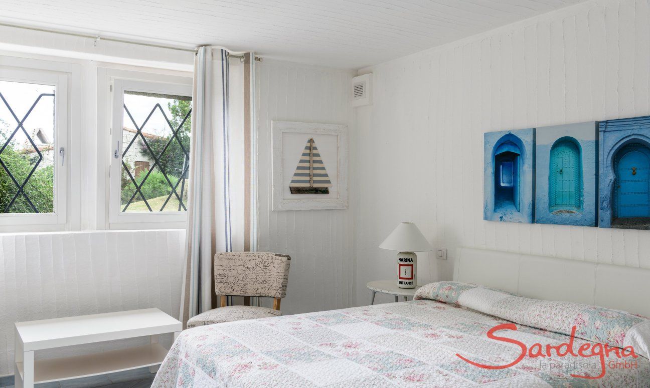 Li Conchi 30 | Bedroom 3 with double bed in the basement floor with window towards the garden Presentation of Li Conchi 30