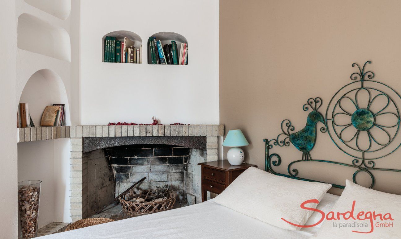 Apartment Orri 3 | Bedroom 2 on the second floor with double bed and fire place App. Orri 3 Tortoli Eastcoast Sardinia