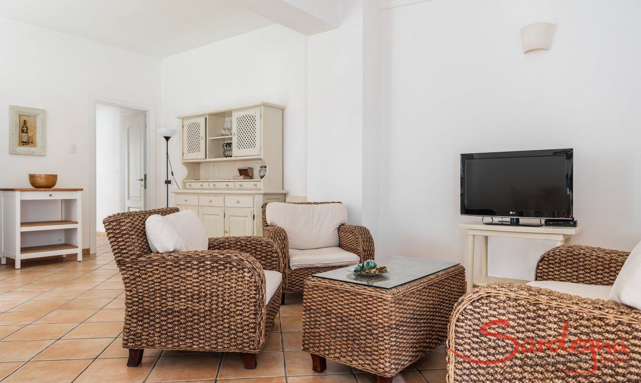 Apartment Orri 2 | Spacious living room with wickered sofa and TV App. Orri 2, Tortoli, Eascoast Sardinia