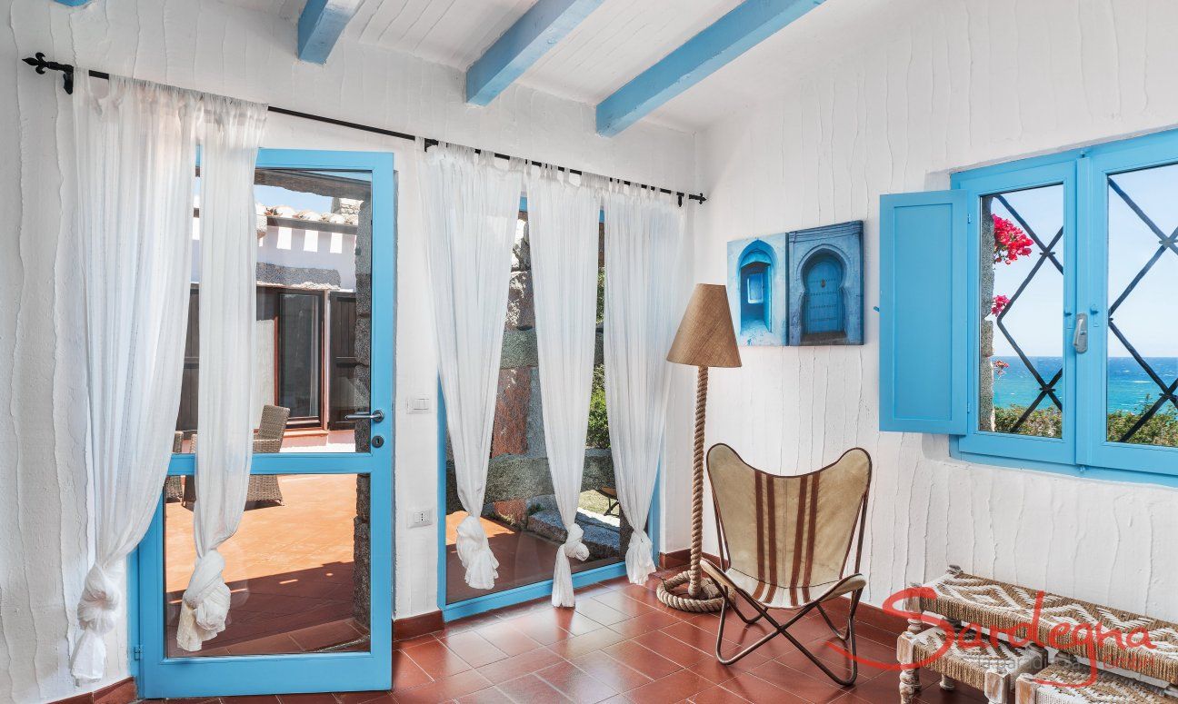 Casa 17 | Living room with windows to the terrace and the sea Casa 17, Sant Elmo, South Sardinia