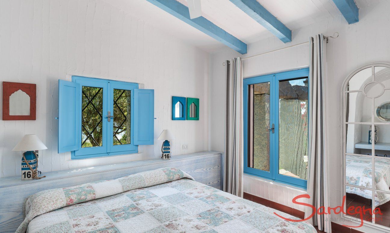 Casa 17 | Bedroom 1 with double bed and garden Casa 17, Sant Elmo, South Sardinia