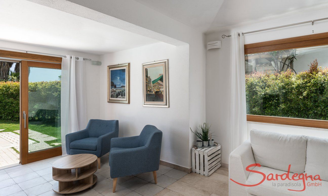 Villa del Campo | Living room with big windows to the green garden Villa del Campo, Is Molas, Pula