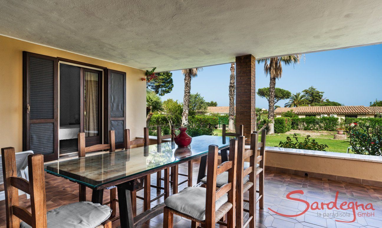 Villa Palme | Dining table on the roofed terrace Villa Palme, Costa Rei