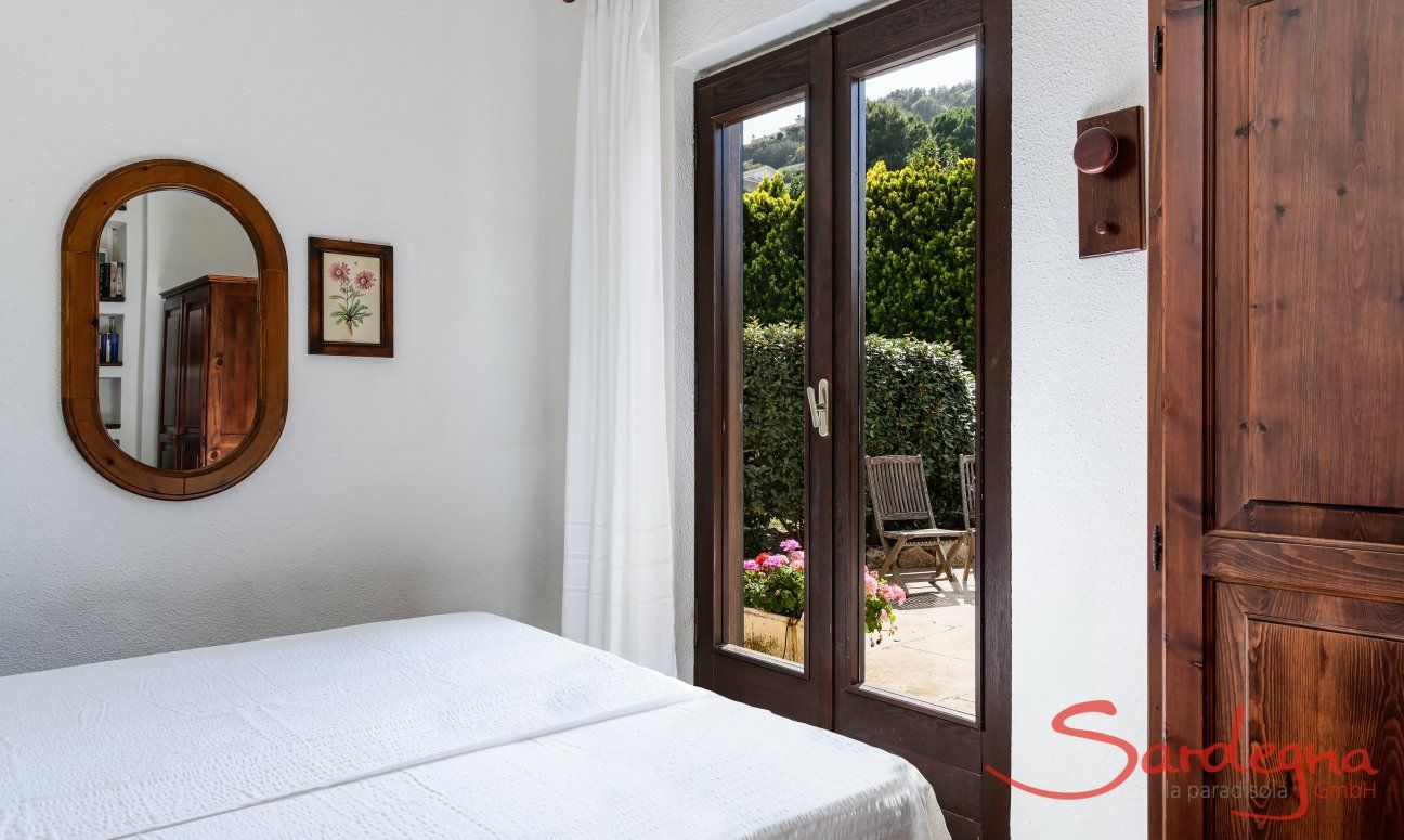 Villa Palme | Bedroom 3 with double bed and door to the terrace Bedroom Villa Palme, Costa Rei
