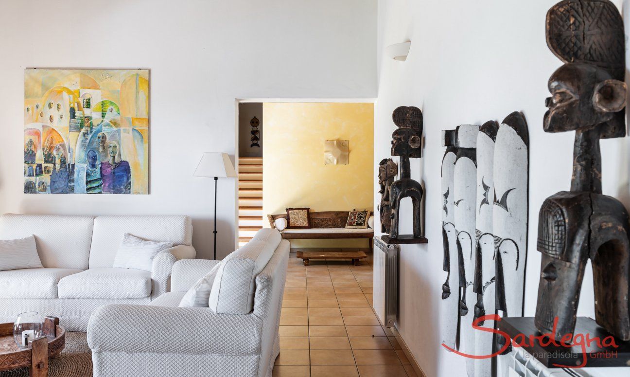 Villa Su Tauloni | The living room is decorated with ethnic furniture from all over the world Villa Su Tauloni, Is Molas, South Sardinia