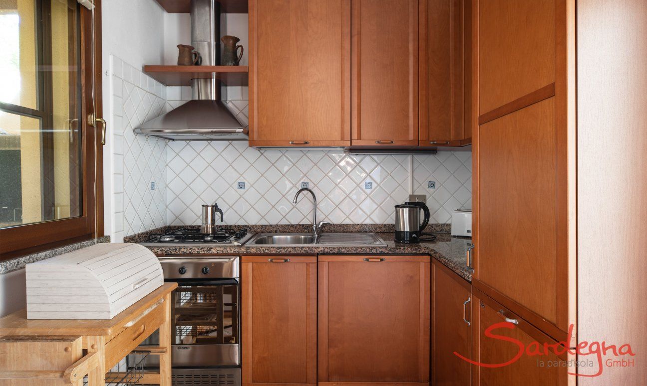 Villa Tiziana 11 | The kitchen boosts dishwasher, gas stove, electric oven and a big fridge and freezer Portrait of the house