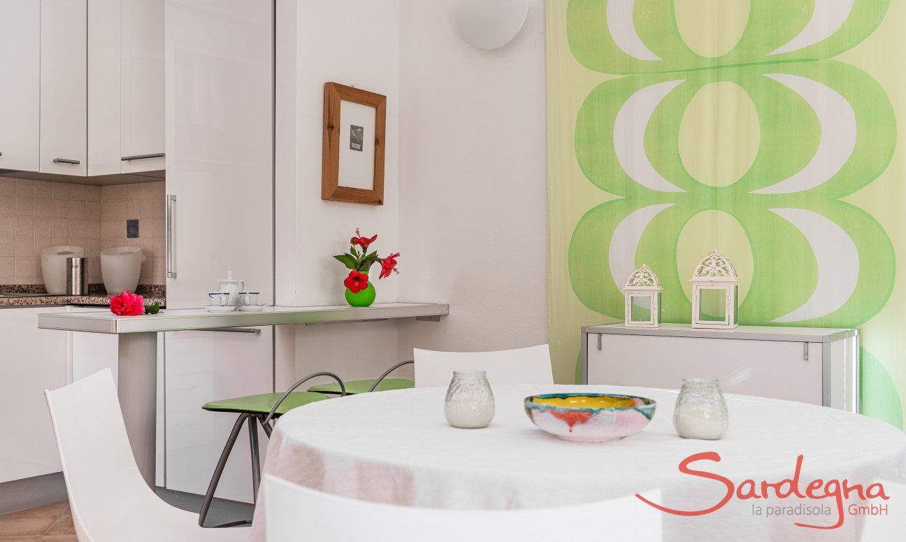 Villa Sandra 43 | Round dining table and view into the kitchen House