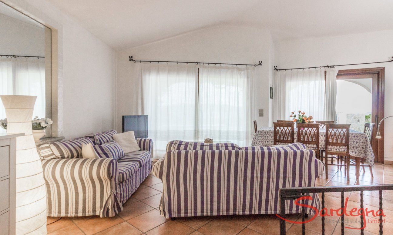 Villa Maestrale | Living room with comfortable sofa and panoramic windows Villa Maestrale, Cala Ginepro, Olbia