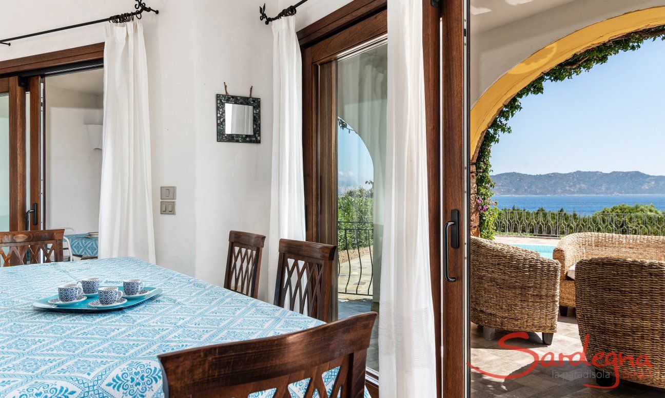 Villa Maestrale | Dining table with a view of the pool and the sea New picture