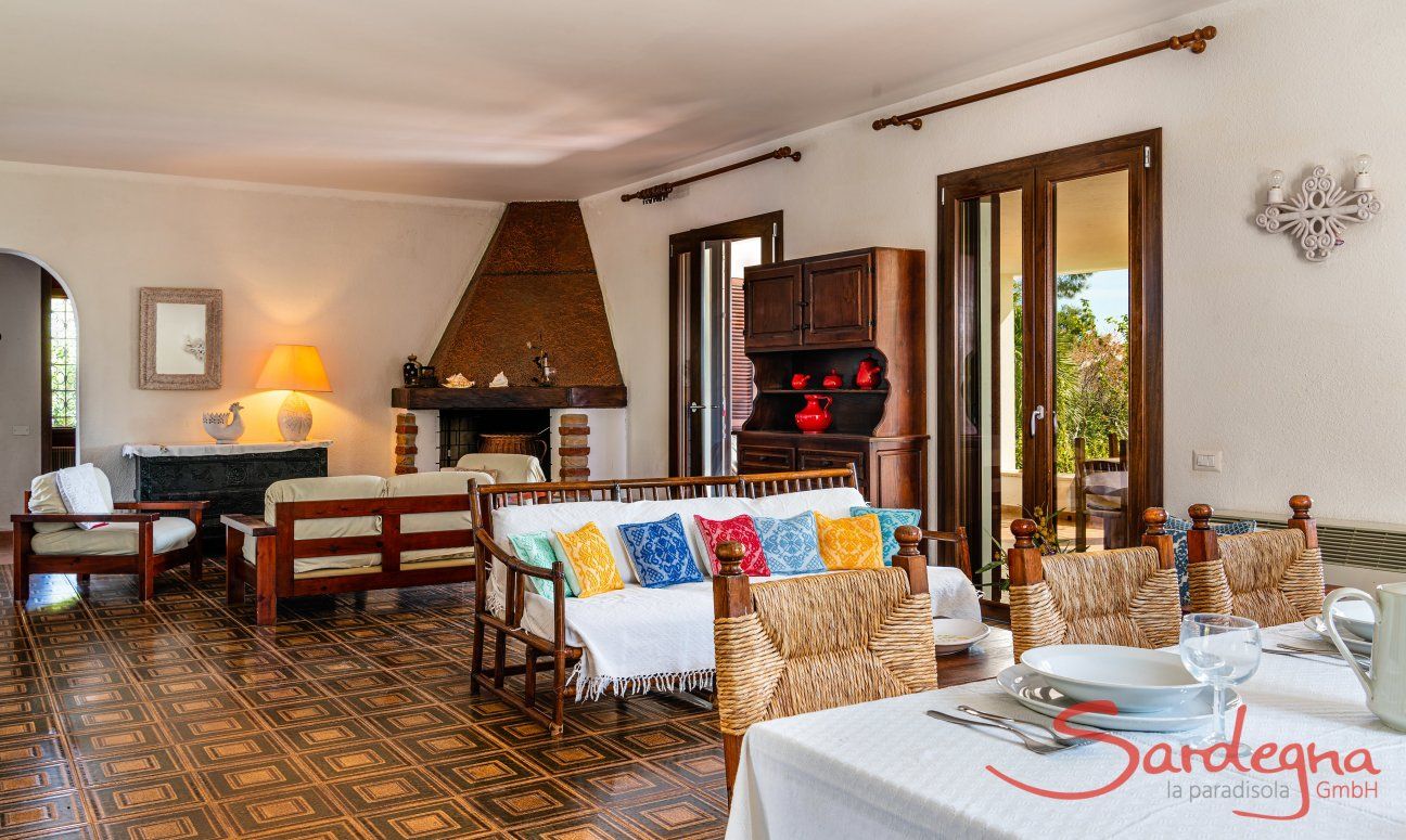 Villa Palme | Living room with fireplace and dining table New Picture
