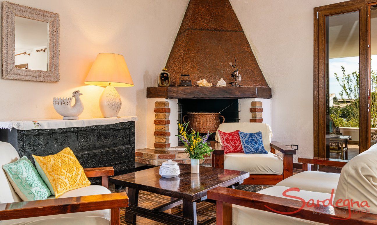 Villa Palme | Sitting area in the living room directly by the fireplace New Picture