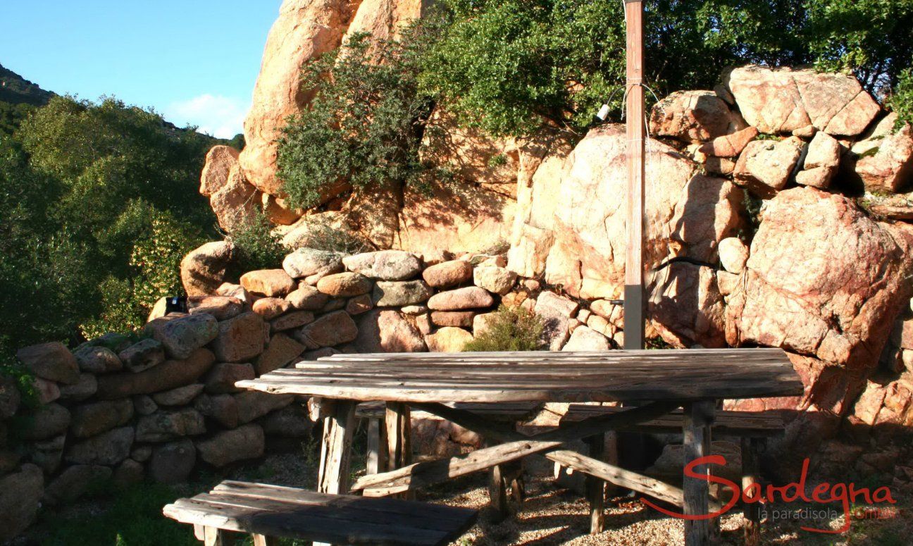 Villa Aquila Alta | Rustic seating area under rocks Barbecue