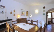Casa Meloni 1 | Living room with sofa, dining table and fire place Living room