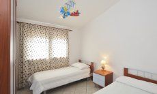 Villa Le Ginestre 2 | Bedroom 4 downstairs with two single beds Bedroom 4 downstairs with two single beds