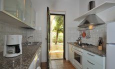 Fully equipped kitchen with garden access