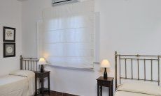 Villa Aquila Giardino | Second bedroom with two single beds Sardinia