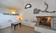 Villa Fiori 4 | Modern, bright living area with sofa and fireplace Modern, bright living area with sofa and fireplace