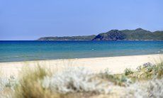 Long white and sandy beach in front of the villa 