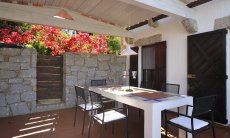 Covered terrace with dining table  