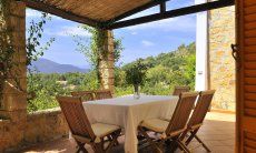 Terrace with dining area and view across the landscape 