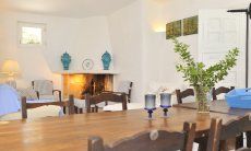 Villa Maria Mercedes | Table with a view towards the fireplace Table living