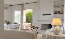 Villa Aquila Alta | Living room with indoor fireplace Sardinia