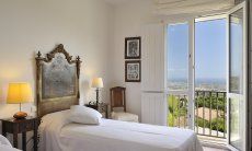 Villa Aquila Alta | Bedroom with view of the outside Sardinia