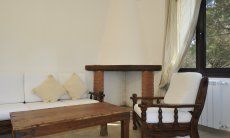 App. Pino | Fireplace and sofa Fireplace