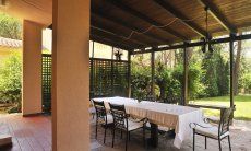 Villa Pino | The roofed terrace becomes an outside living room Terrace and garden