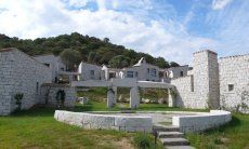 Li Conchi 25 | A path with granite arches and places connects the houses with the shared pool A path with granite arches and places connects the houses with the shared pool