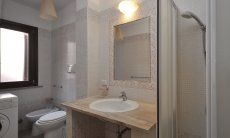 Apartment Castededdu 6 | Bathroom with shower, bidet and washing maschine Sardinia