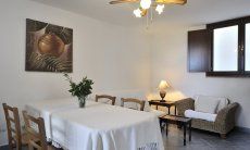 Apartment Castededdu 8 | Living room with dining table and sofa corner Living room with dining table and sofa corner
