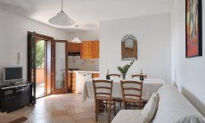 Apartment Castededdu 6 | Living room with kitchen and dining table Living room with kitchen and dining table