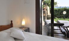 Apartment Castededdu 9 | Bedroom 1 with double sized bed and terrace access Bedroom 1 with double sized bed and terrace access