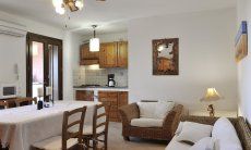 Apartment Castededdu 9 | Living area with dining table, sofa corner and kitchen Living area with dining table, sofa corner and kitchen