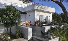 Apartment Cala Liberotto I | Terrace and house on the beach Cala Liberotto I
